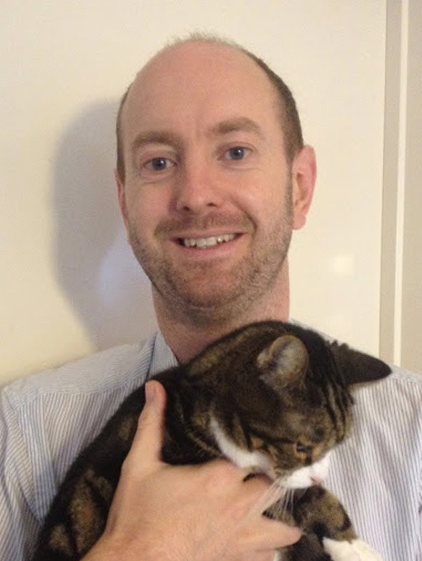 Dr Richard Woolley holding a cat